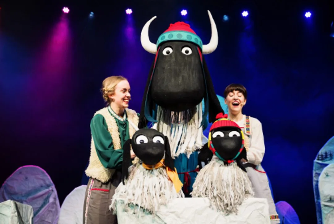 Cast members with Gertie and the yak puppets on stage in The Littlest Yak.