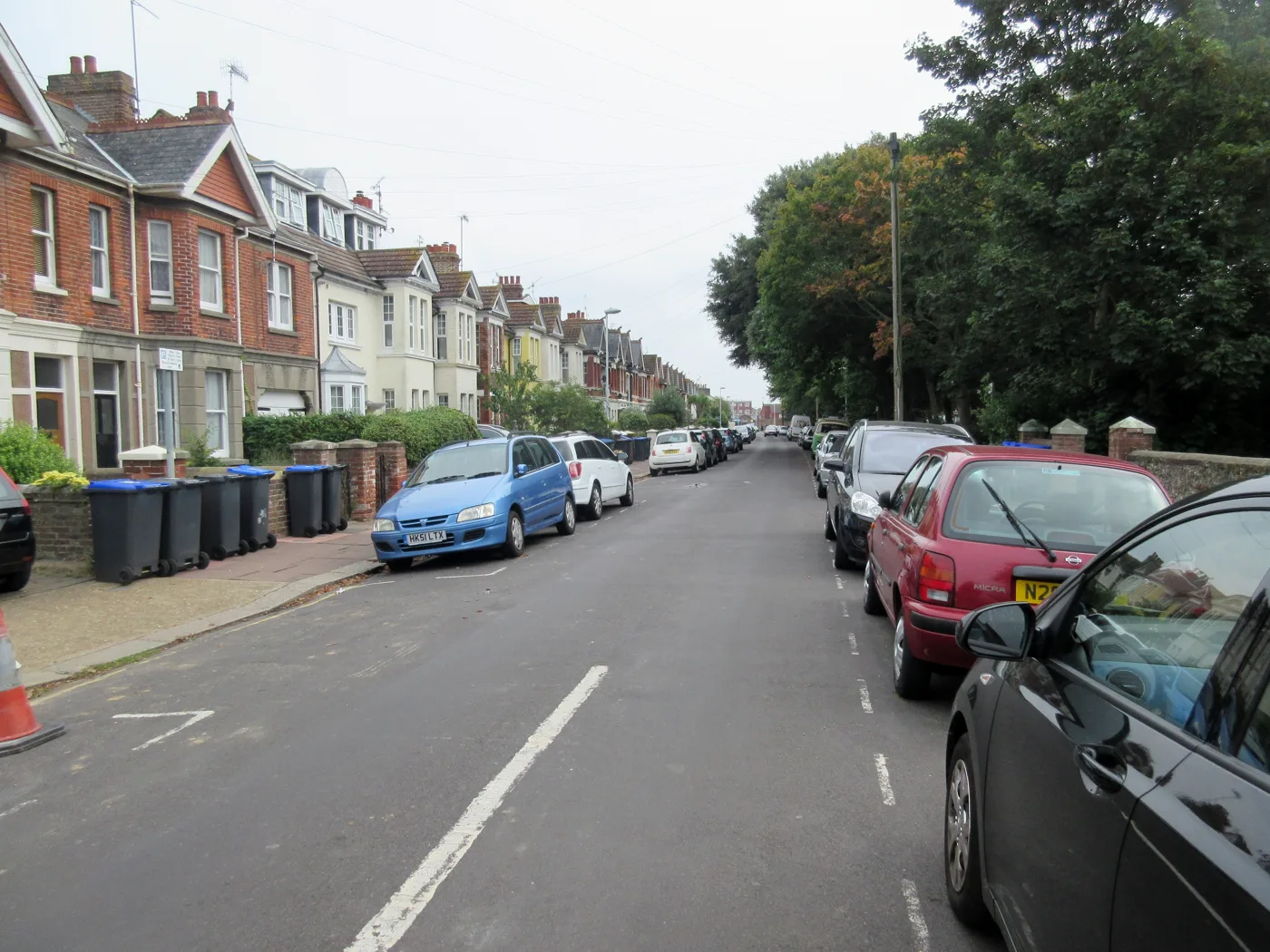 Bins out on the kerb in St Matthew's Road, Worthing. Blue lids are recycling, dark grey and black lids are general waste.
