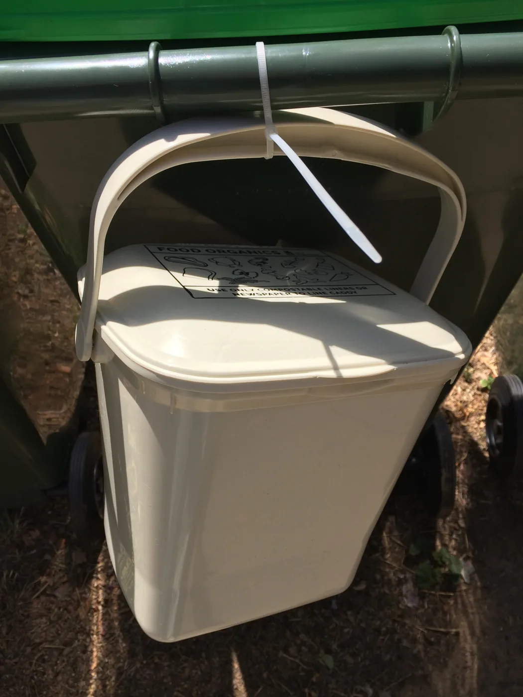 A lidded kitchen food waste caddy. Worthing households will get a 5-litre caddy for the kitchen and a 23-litre lockable bin for the kerb.