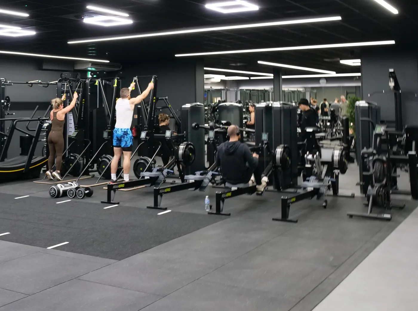 People using SkiErg machines and rowing machines in the new functional training area at Worthing Leisure Centre
