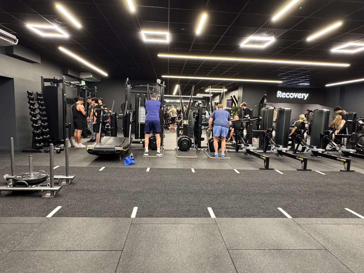 The new gym floor at Worthing Leisure Centre, with treadmills, dumbbell racks and strength machines under strip lighting and a Recovery sign on the far wall